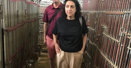 maya stands around the small cages of bile bears in Vietnam